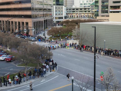 People wait in line for the county-wide Democratic caucus in Boise, Idaho, on Tuesday.